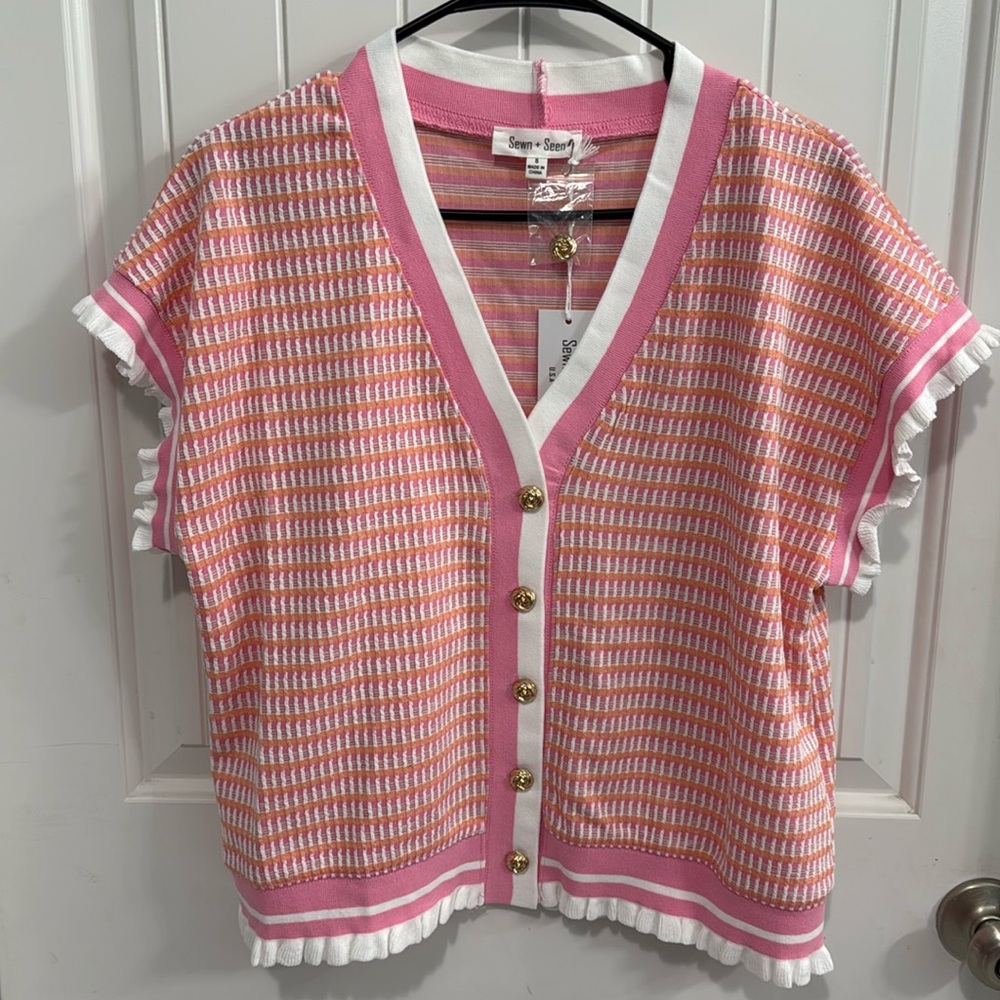 Women’s pink and orange button-down cardigan